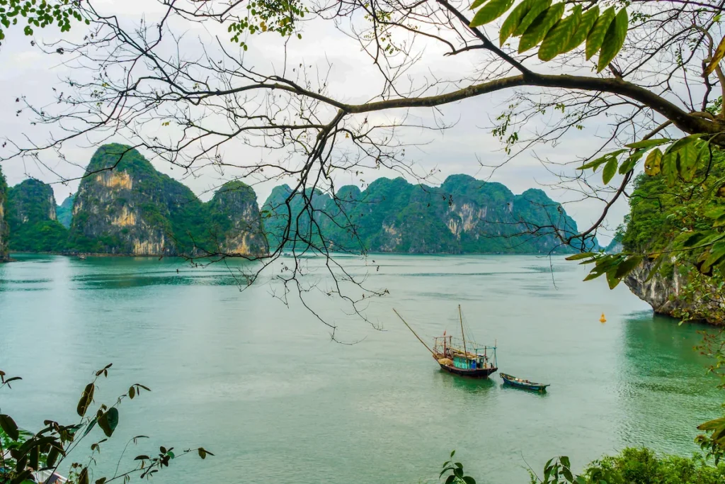 Halong Bay cruise among limestone islands and emerald waters