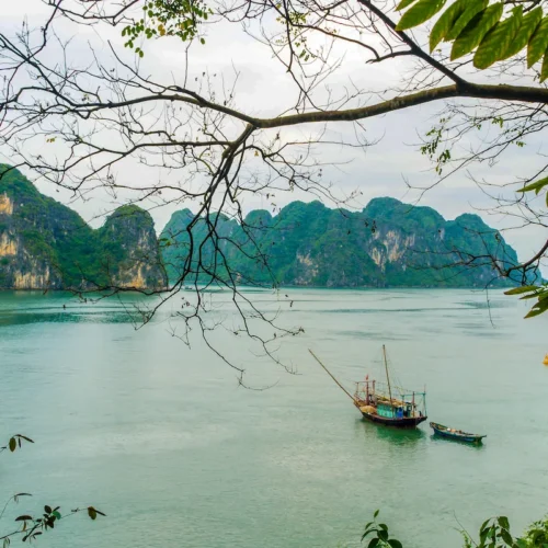 Halong Bay cruise among limestone islands and emerald waters