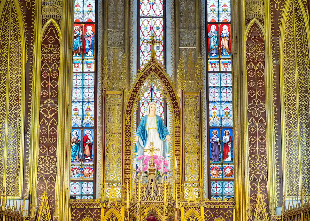 The high altar and stained glass windows inside So Kien Basilica in Ha Nam, Vietnam.