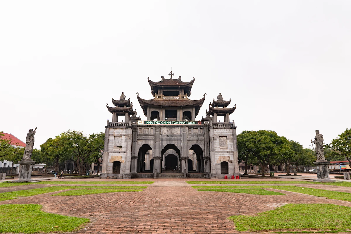 Front view of Phat Diem Cathedral's traditional stone gate in Ninh Binh