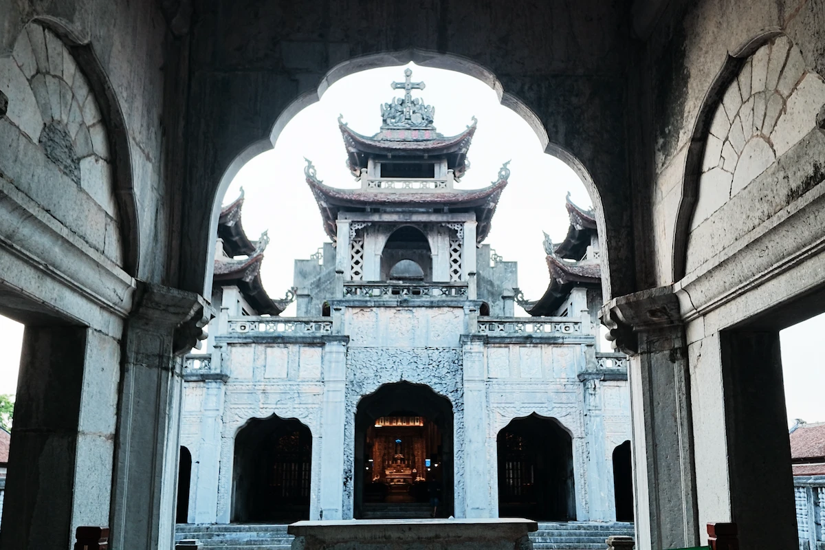 Interior view of Phat Diem Stone Cathedral with traditional Vietnamese architectural details