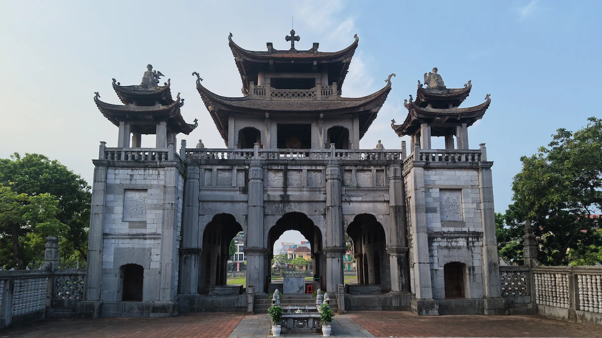 Rear view of the traditional stone main gate at Phat Diem Cathedral