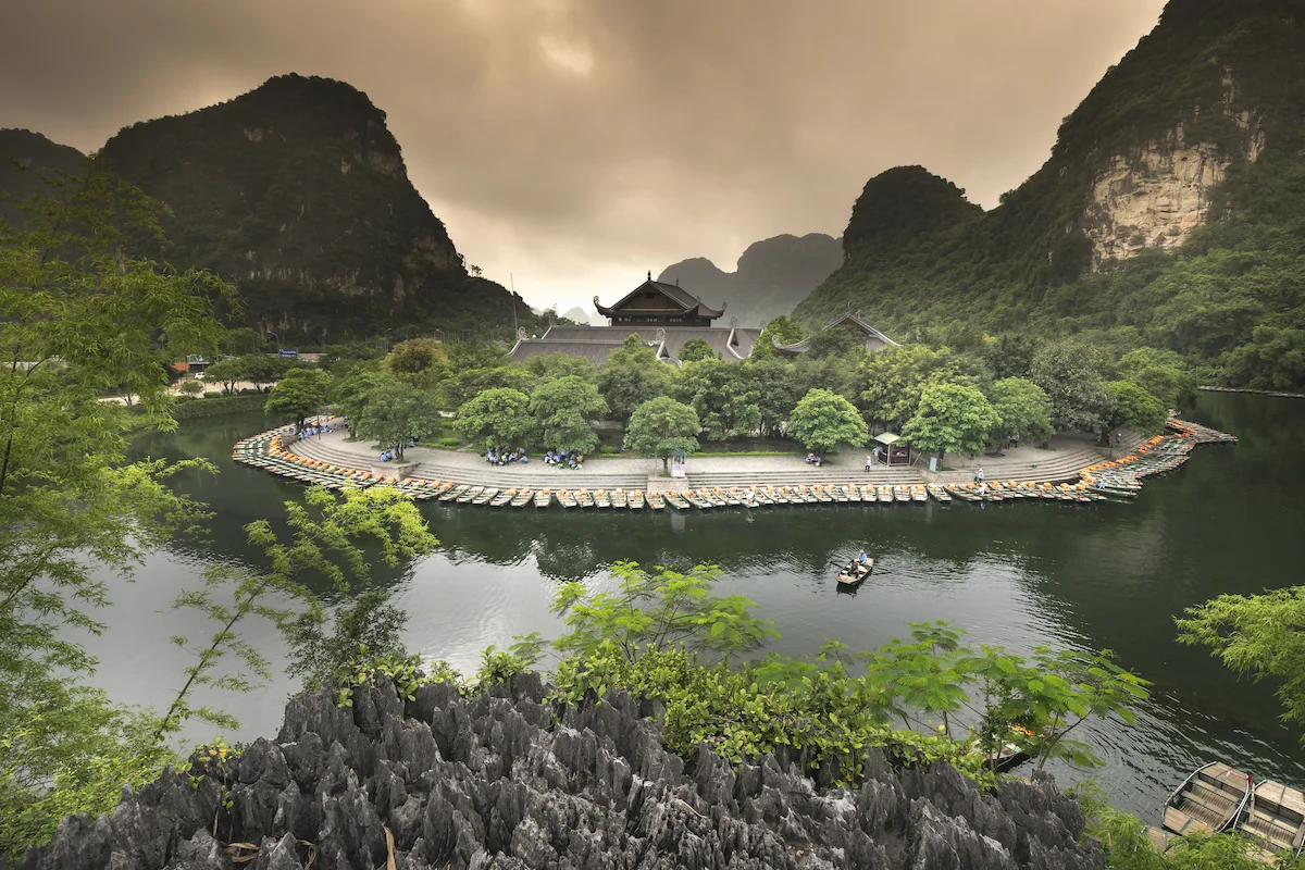 Trang An Landscape Complex with temples, boats and limestone mountains in Ninh Binh