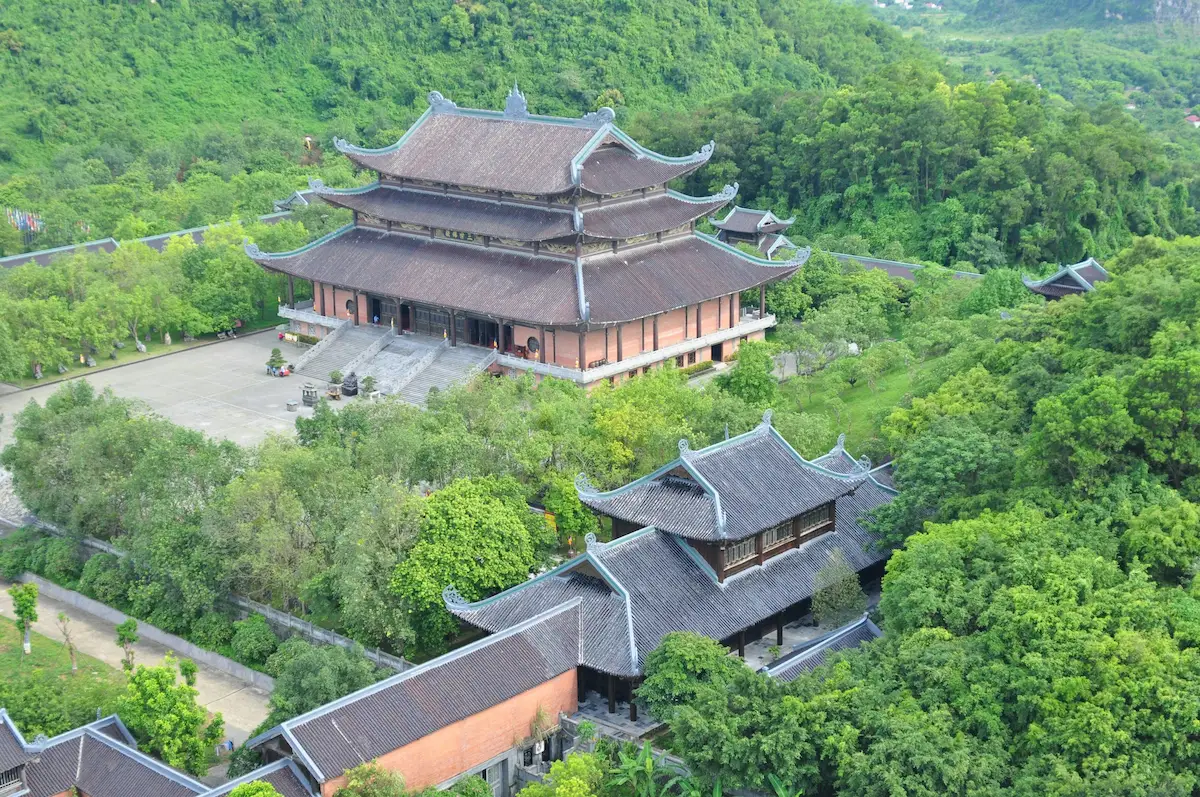 Bai Dinh Pagoda surrounded by lush green hills in Ninh Binh