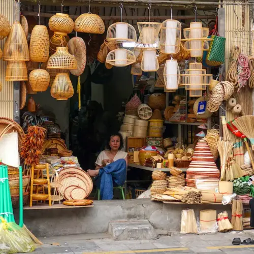 Traditional bamboo crafts displayed outside a Hanoi Old Quarter shop
