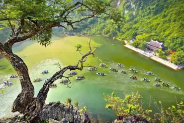 Ninh Binh 2 Days 1 Night Itinerary featuring scenic boat tours on a peaceful lake