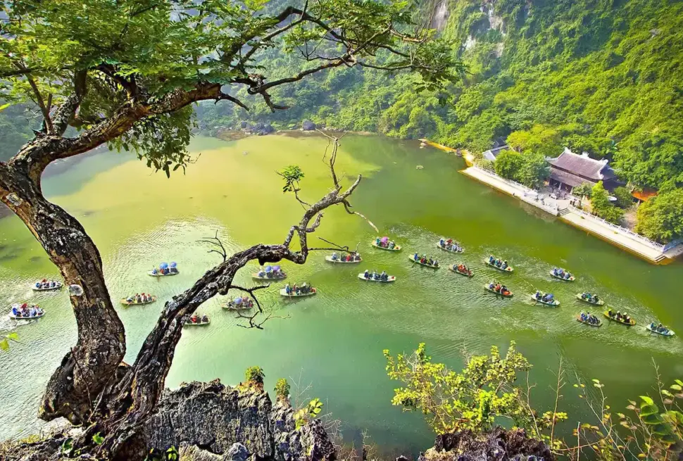 Ninh Binh 2 Days 1 Night Itinerary featuring scenic boat tours on a peaceful lake