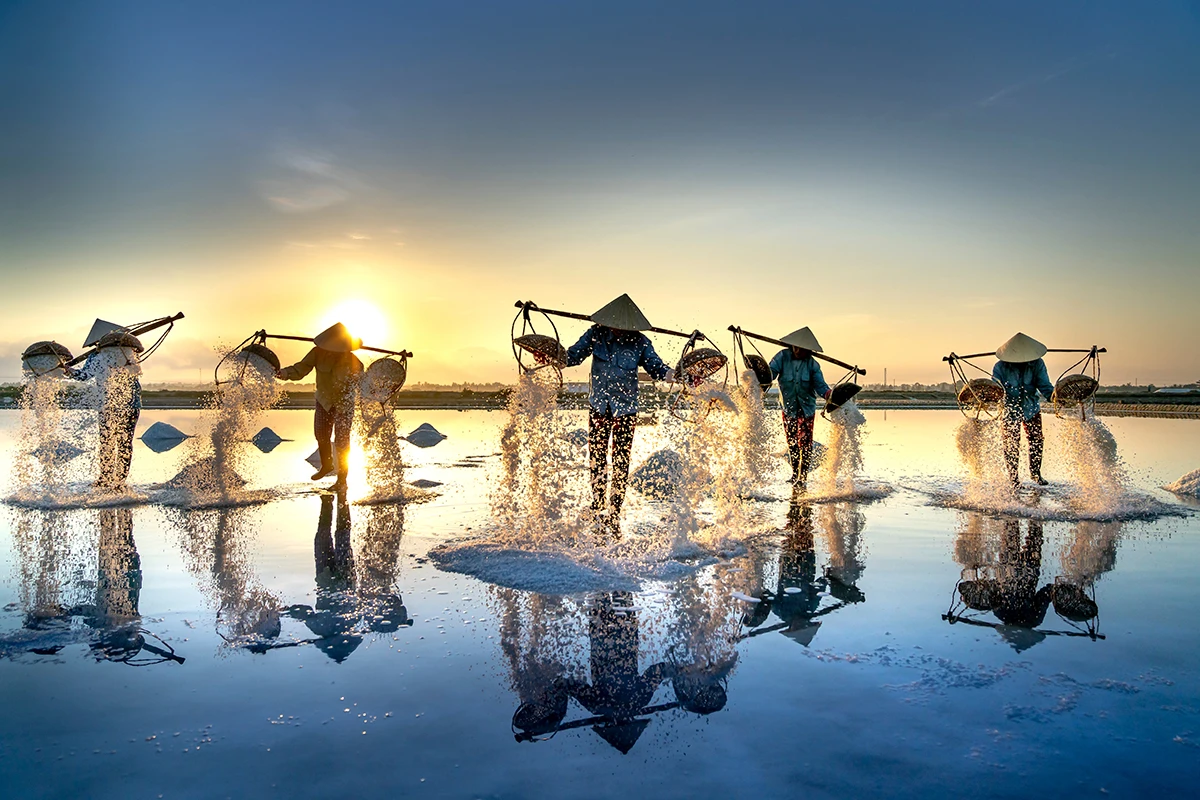 Salt farmers working at a salt field