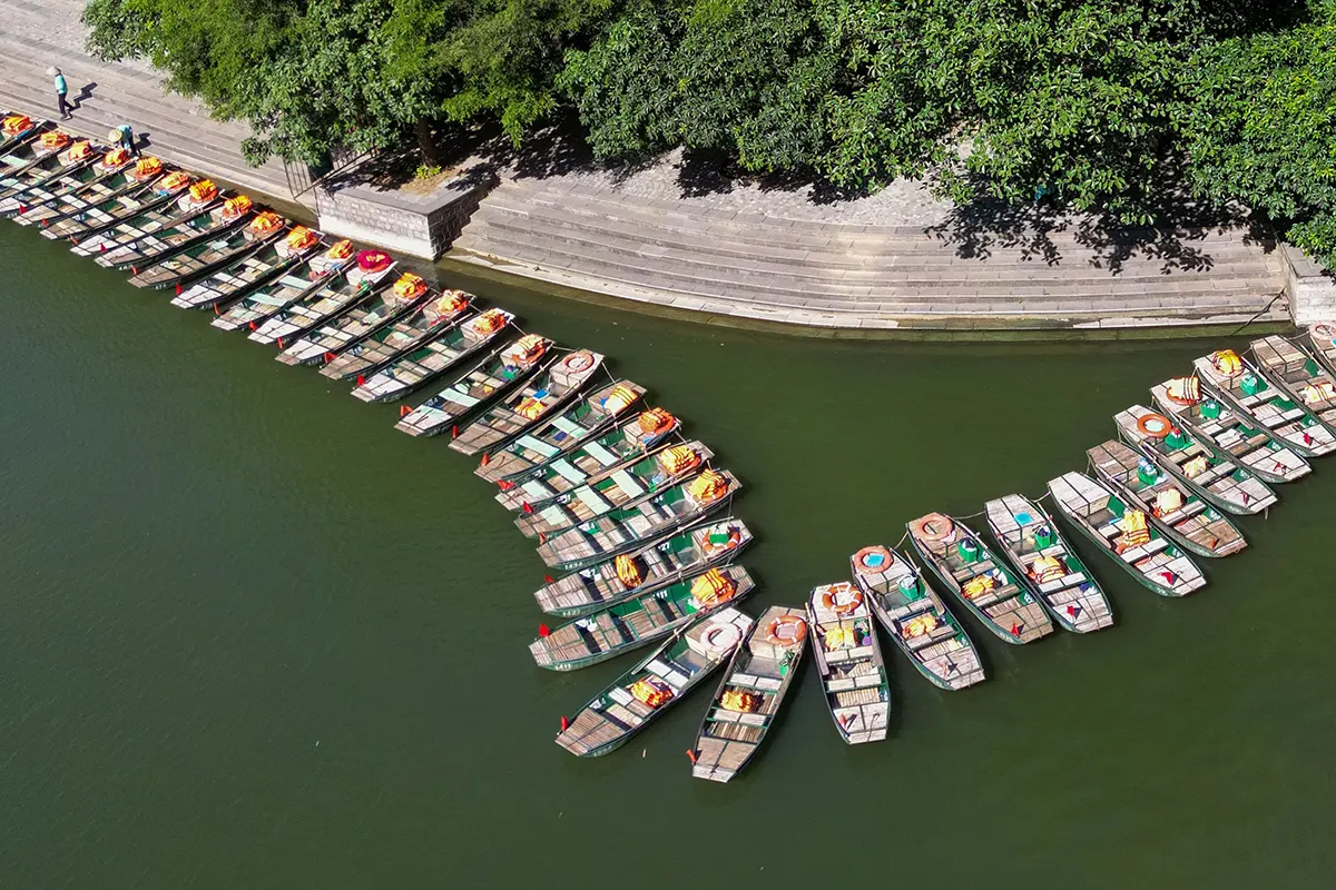 Traditional boats lined along the river at Trang An Scenic Landscape Complex, Ninh Binh