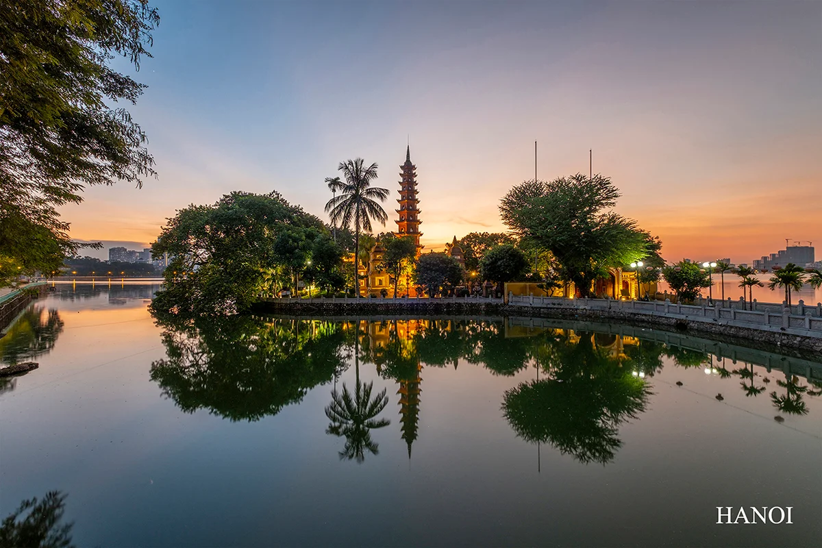 Hanoi cityscape with Tran Quoc Pagoda at sunset