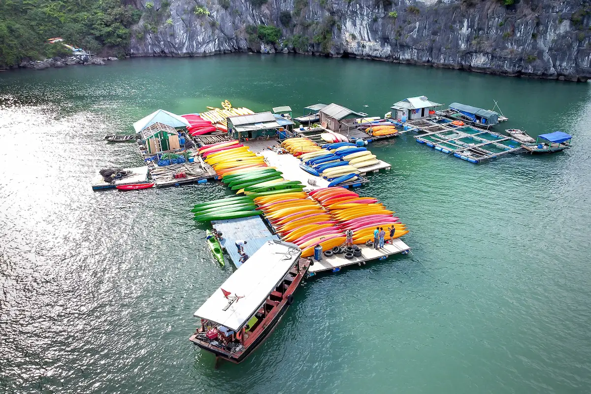 Colorful kayaks at a floating dock in Lan Ha Bay