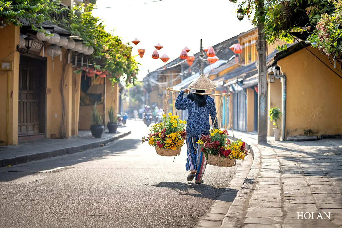 Hoi An Ancient Town street with local flower vendor