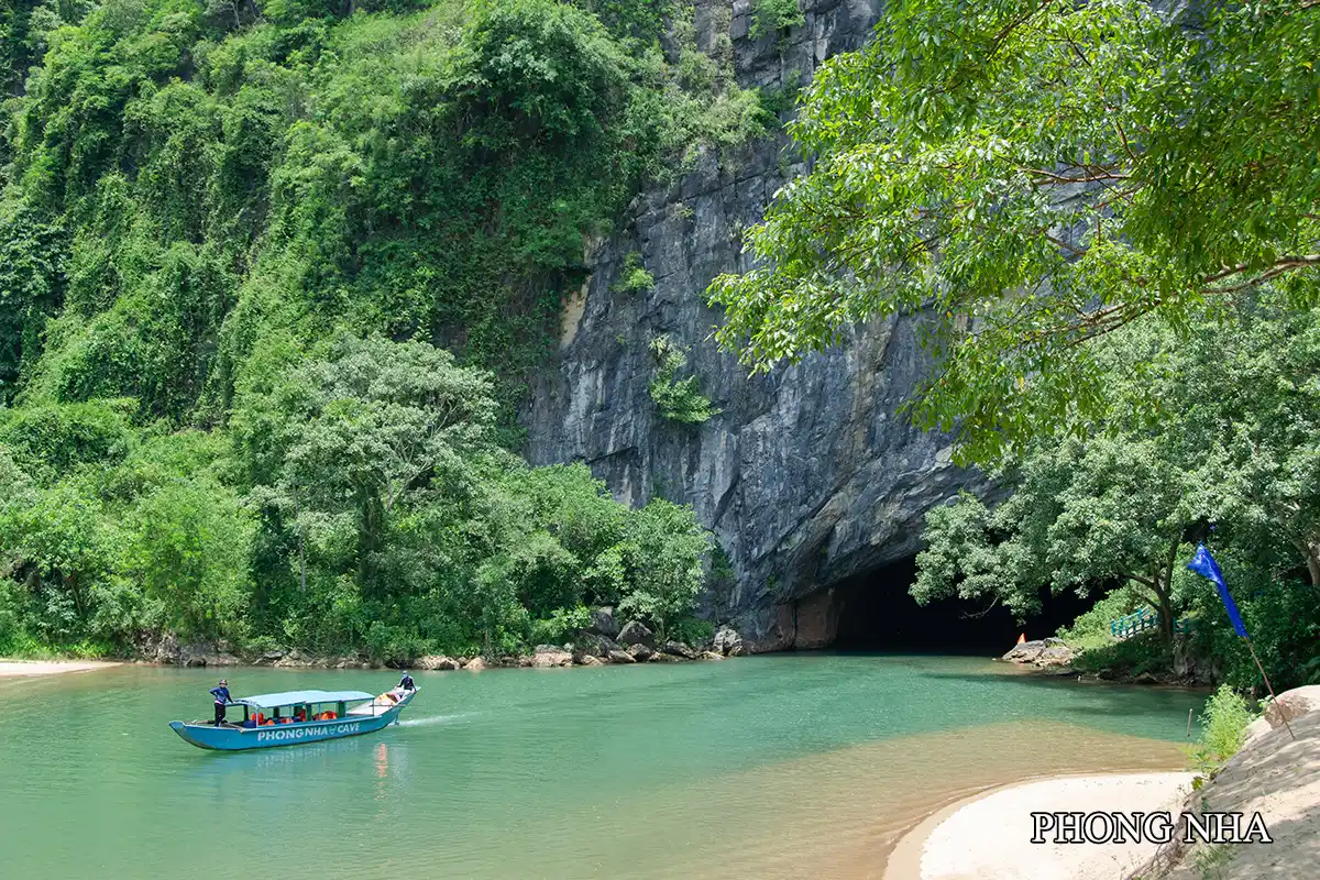 Phong Nha Cave entrance with boat on the river